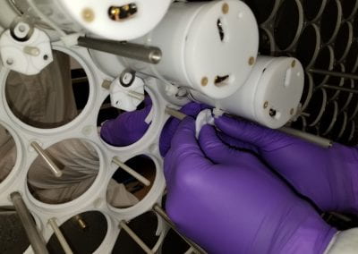 A close-up photo of one stage of the PMT installation procedure